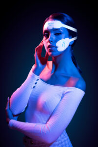 Paradise Medical Maui, Woman wearing Emface device for facial rejuvenation treatment.