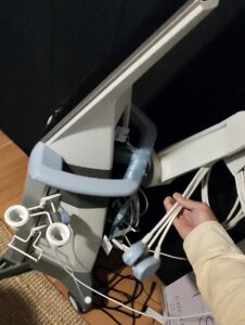 Paradise Medical Maui, Medical ultrasound machine with transducers being held, used for diagnostic imaging.