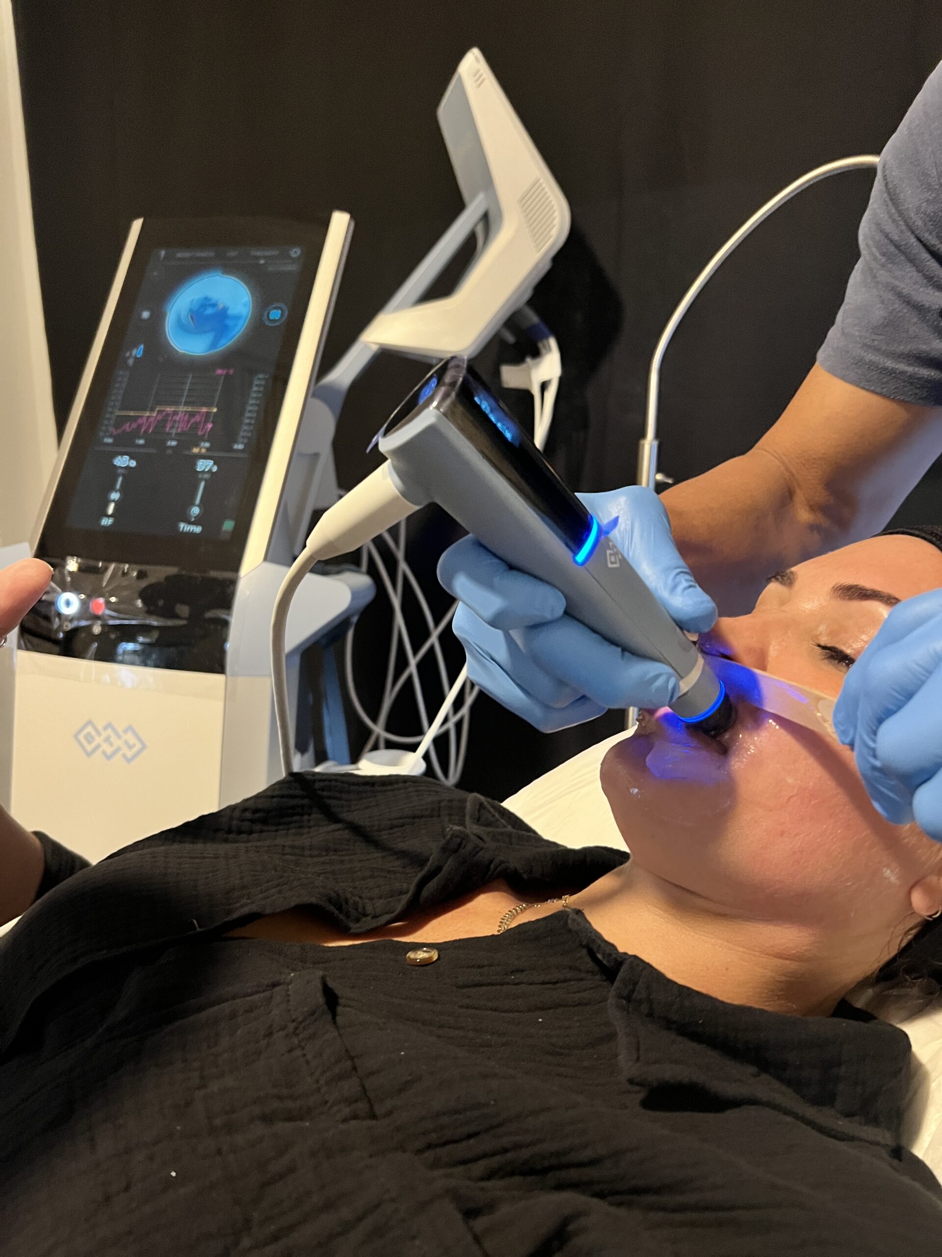 Paradise Medical Maui, Woman receiving a facial treatment with advanced skincare technology.