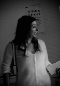 Paradise Medical Maui, Woman at eye doctor, vision chart in background.