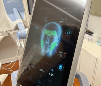 Paradise Medical Maui, EMFACE device screen showing facial therapy areas and settings.